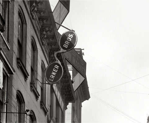 The Erker Bros Optical Co sign at their storefronton Olive Street. After hisOlympic triumph, August (“Gus”) joined the family optical business. His brother, founderA.P., served as the official photographer of the 1904 World’s Fair.